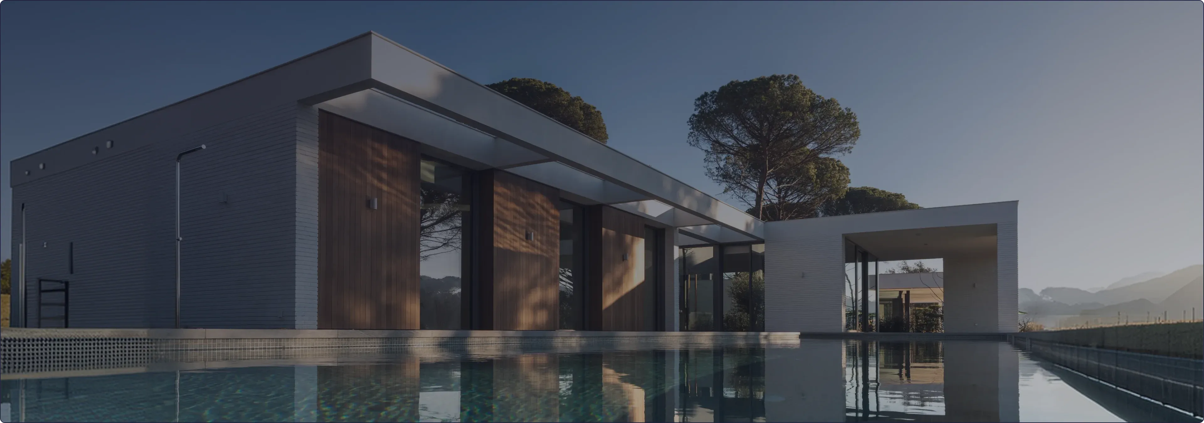 Poolside home at dusk, the kind of property LN Property Buyers, Sydney buyers agents Laura Nocera and Luis Lequerica, secure for clients