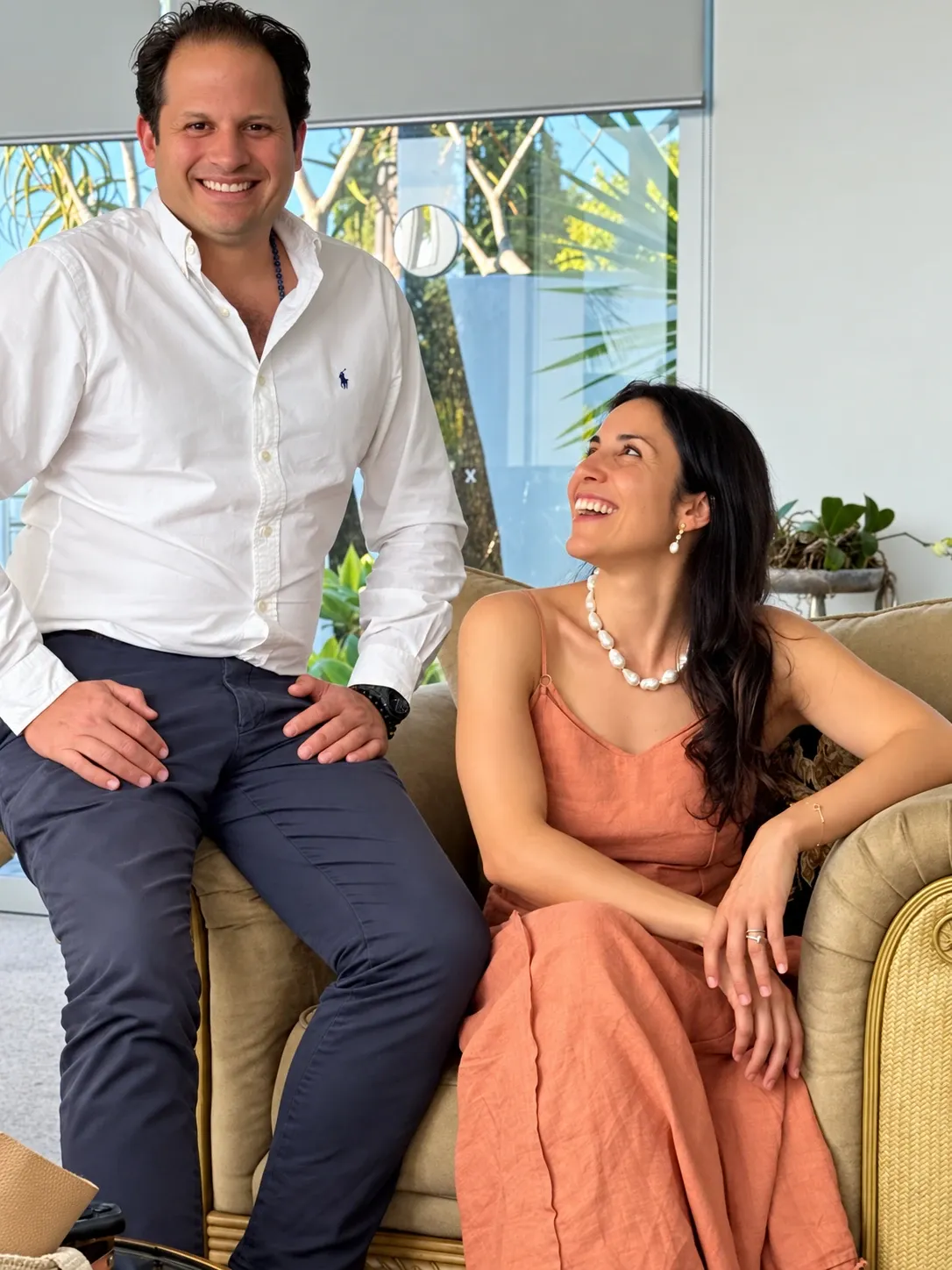 Laura Nocera and Luis Lequerica sharing a laugh in the office of LN Property Buyers, Sydney buyers agents